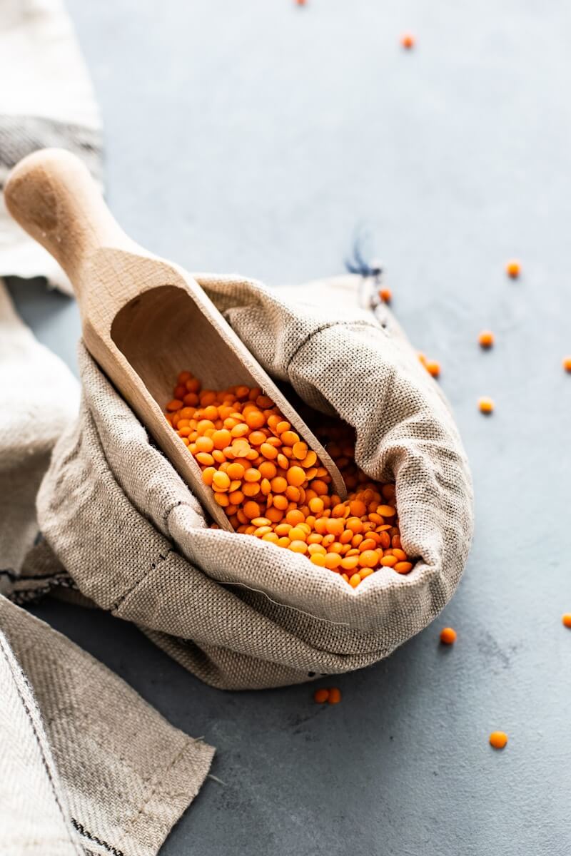 Photo by Monika Grabkowska orange beans in sack