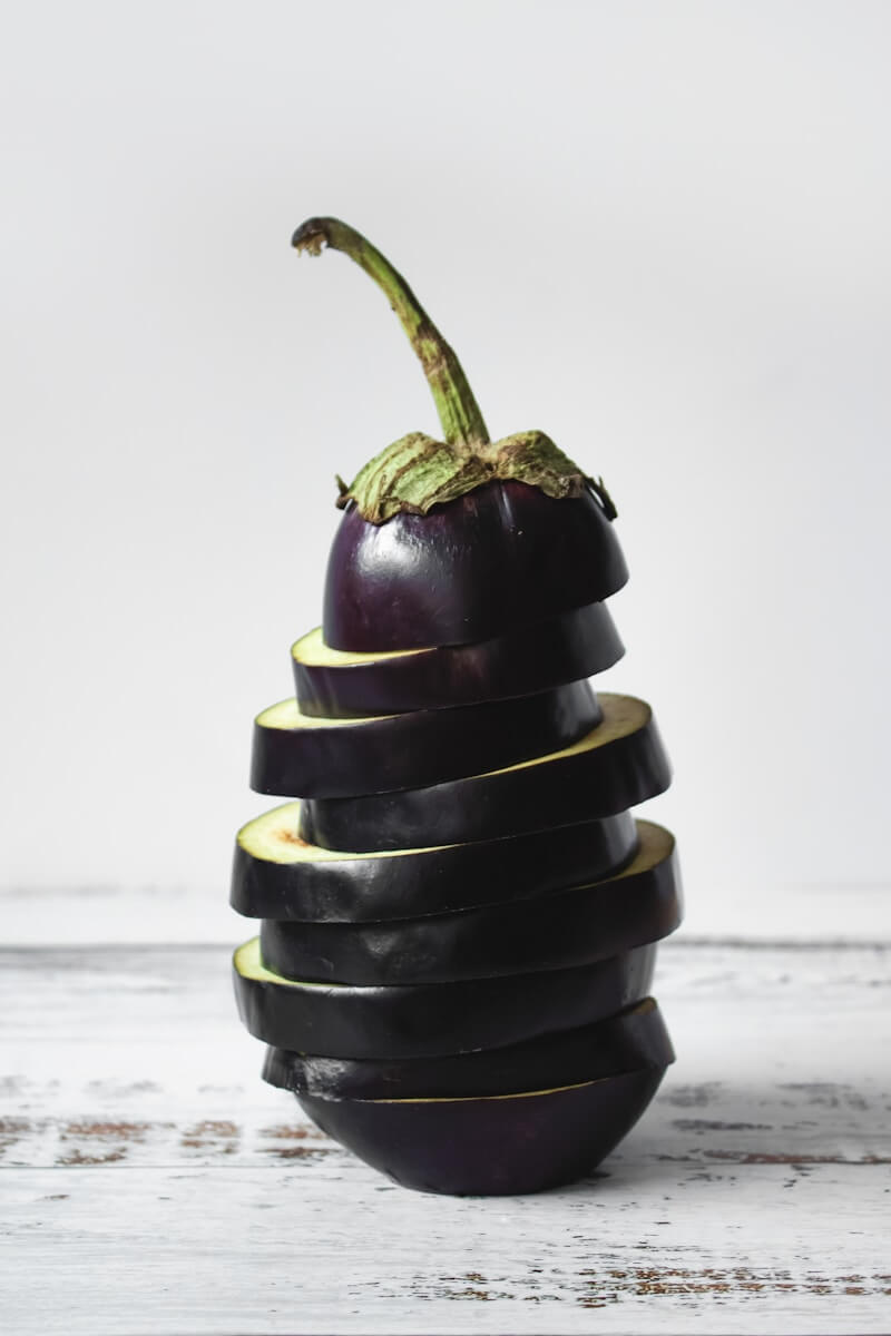 Photo by Tijana Drndarski green bell pepper on black and white stripe textile